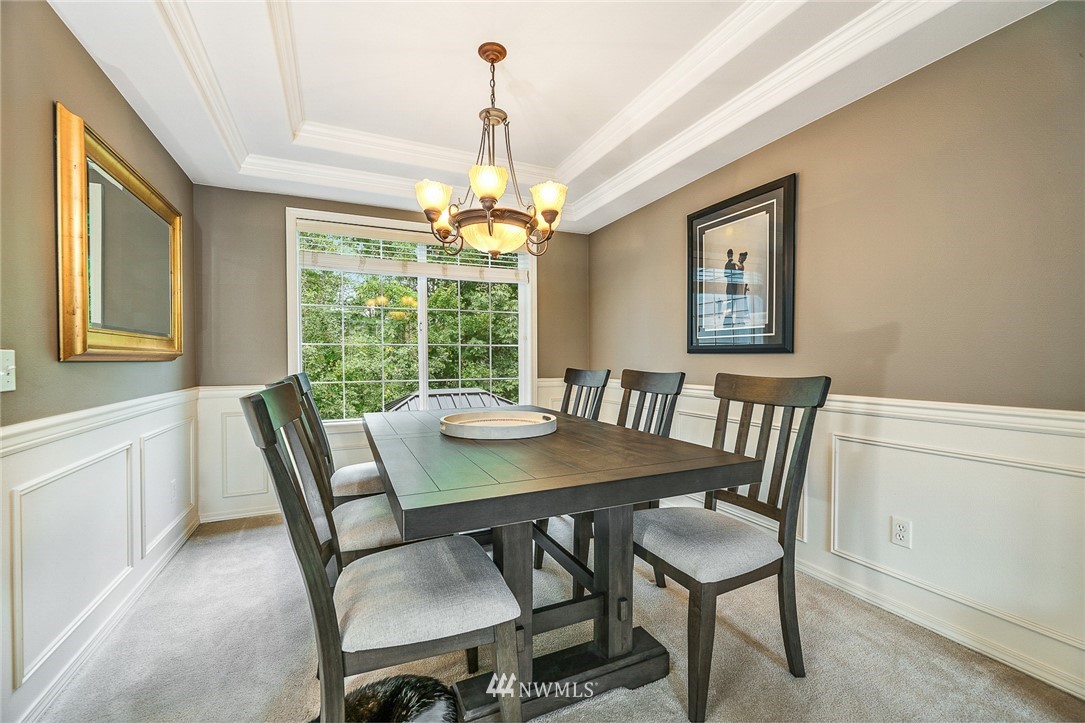 1117 184th Place Southeast Bothell, WA 98012 - Photo 8 of 40 a view of a dining room with furniture window and outside view