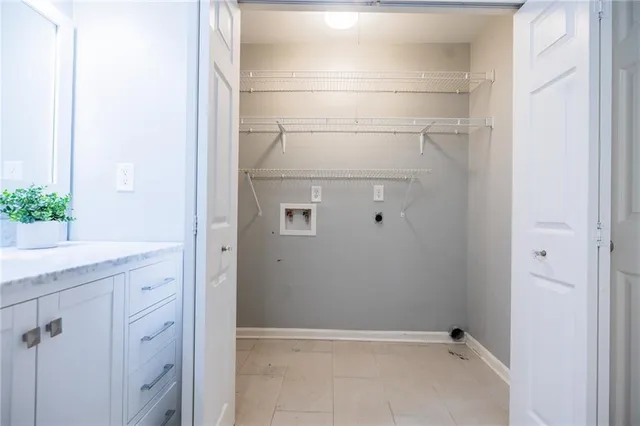 a bathroom with a granite countertop sink and mirror