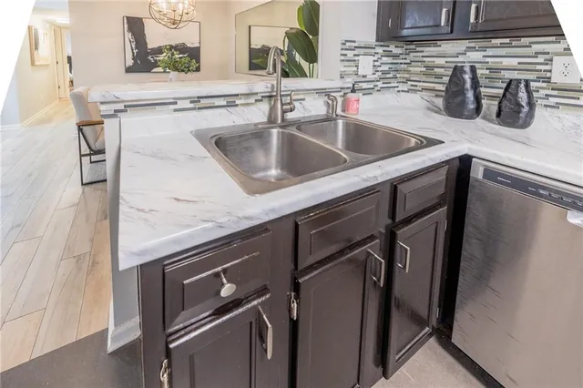 a kitchen with a sink and cabinets