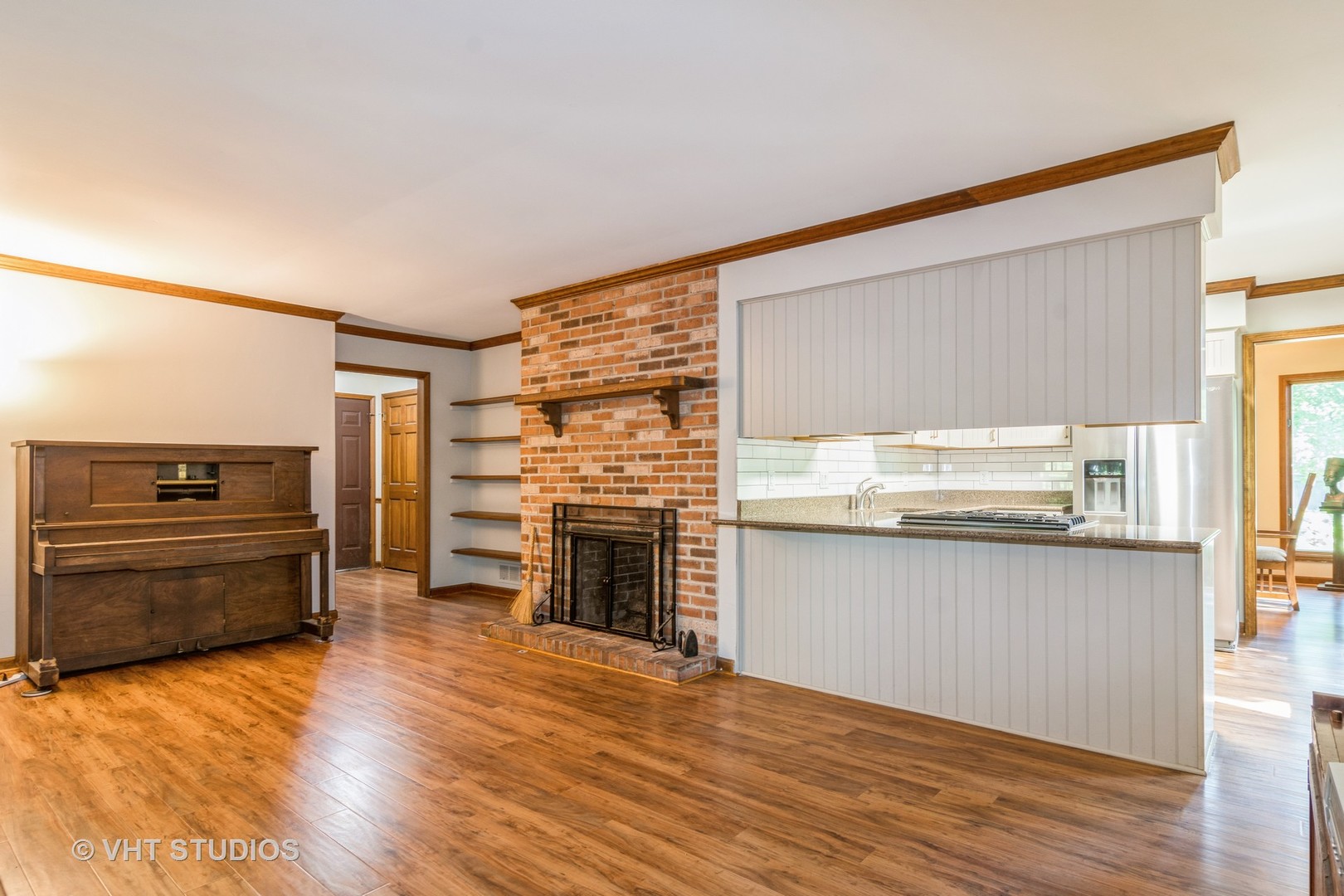 43-w757 Old Midlothian Road Elburn, IL 60119 - Photo 17 of 40 a kitchen with granite countertop a stove cabinets and wooden floor