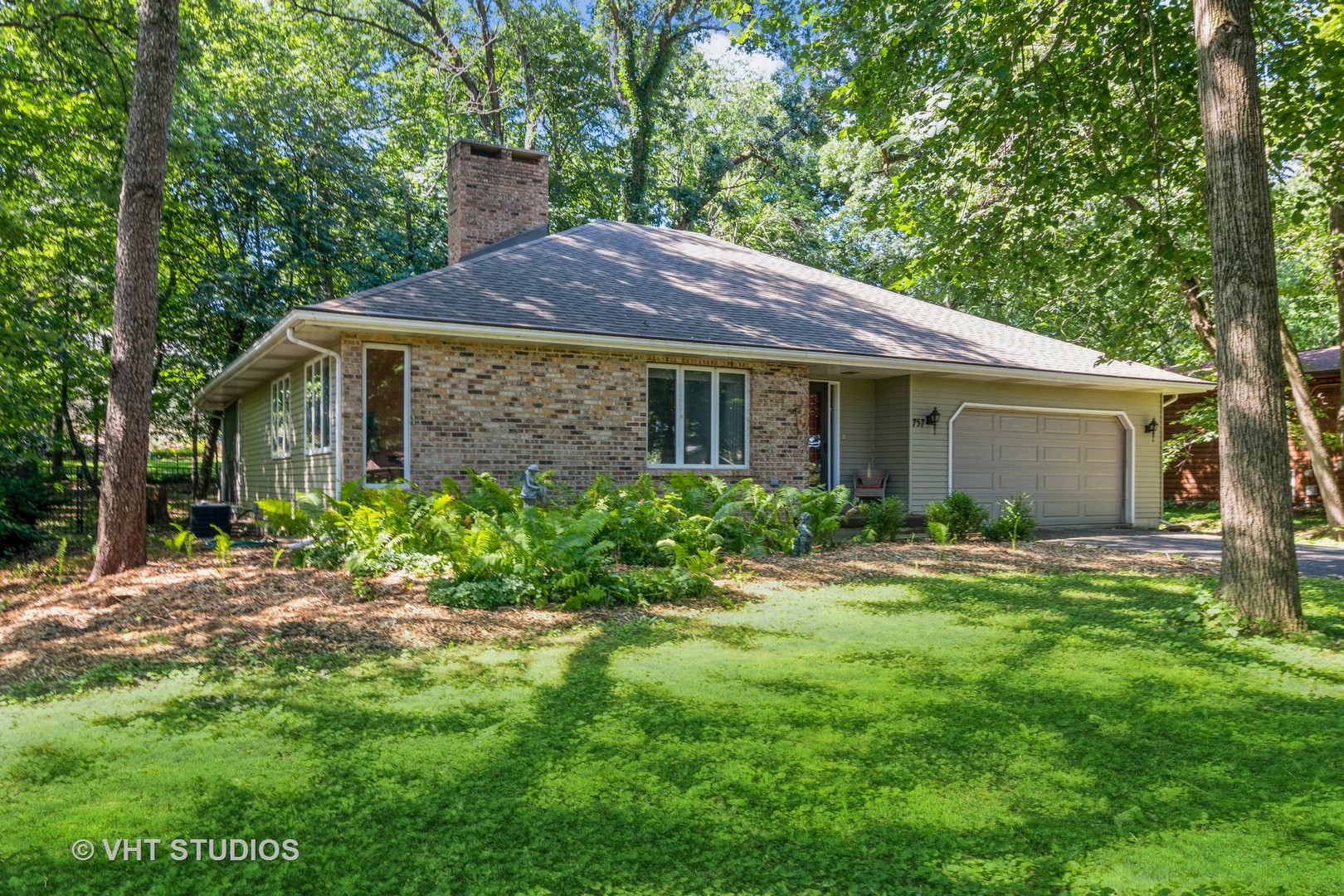 43-w757 Old Midlothian Road Elburn, IL 60119 - Photo 4 of 40 a front view of a house with a garden