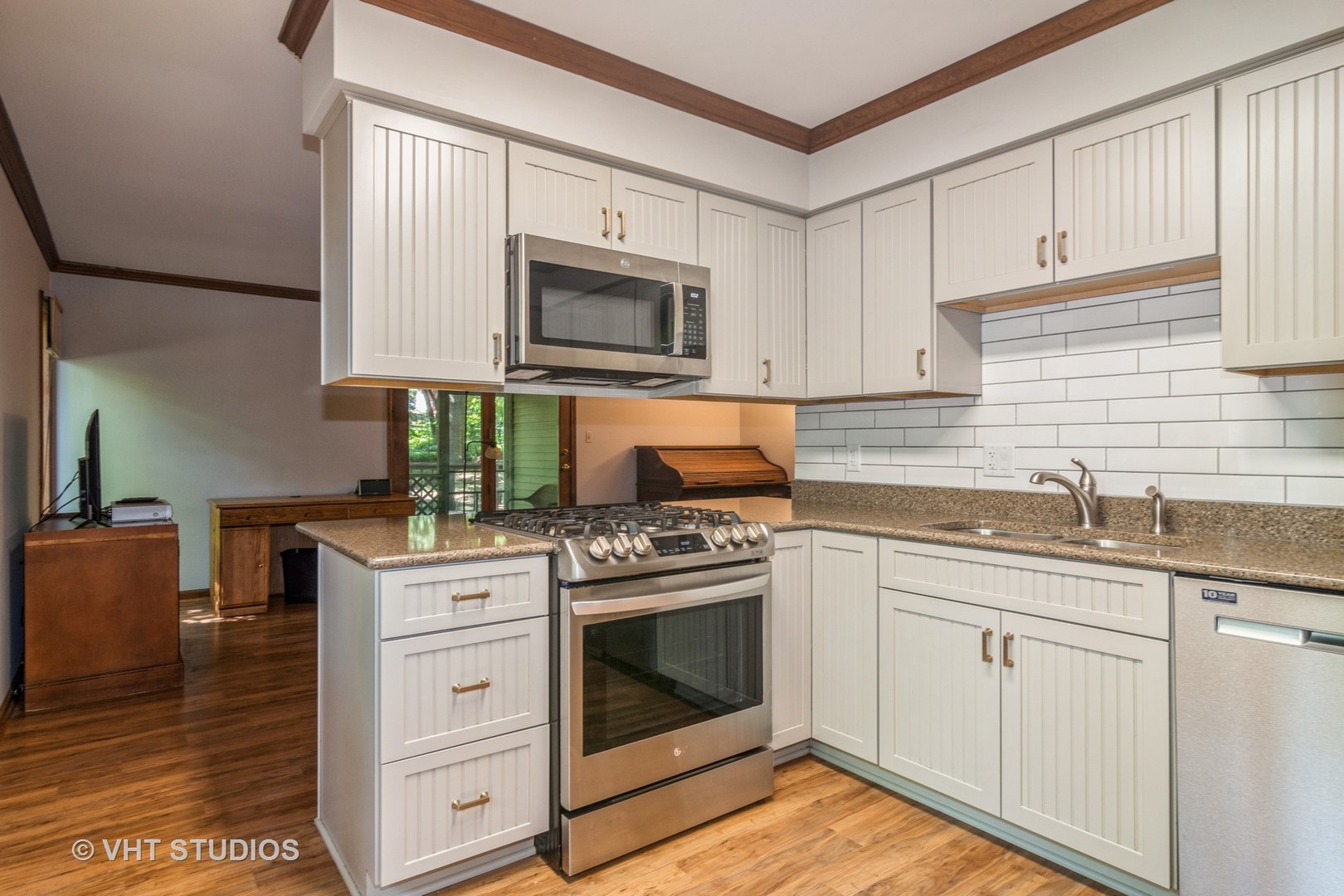 43-w757 Old Midlothian Road Elburn, IL 60119 - Photo 9 of 40 a kitchen with white cabinets stainless steel appliances and sink