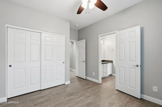 an empty room with closet area