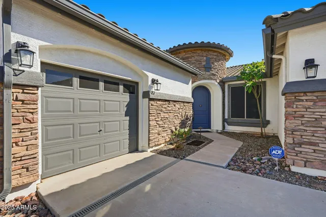 a front view of a house with a garage