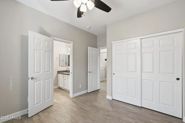 a view of livingroom with hardwood floor and ceiling fan