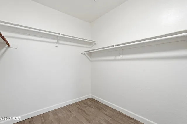 a view of an empty walk in closet