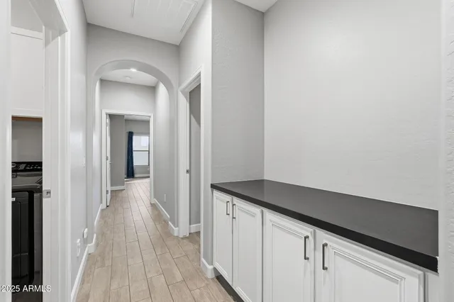 a kitchen with a sink and cabinets