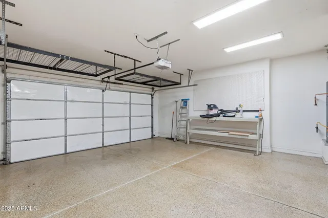 a bedroom with a bed and glass door