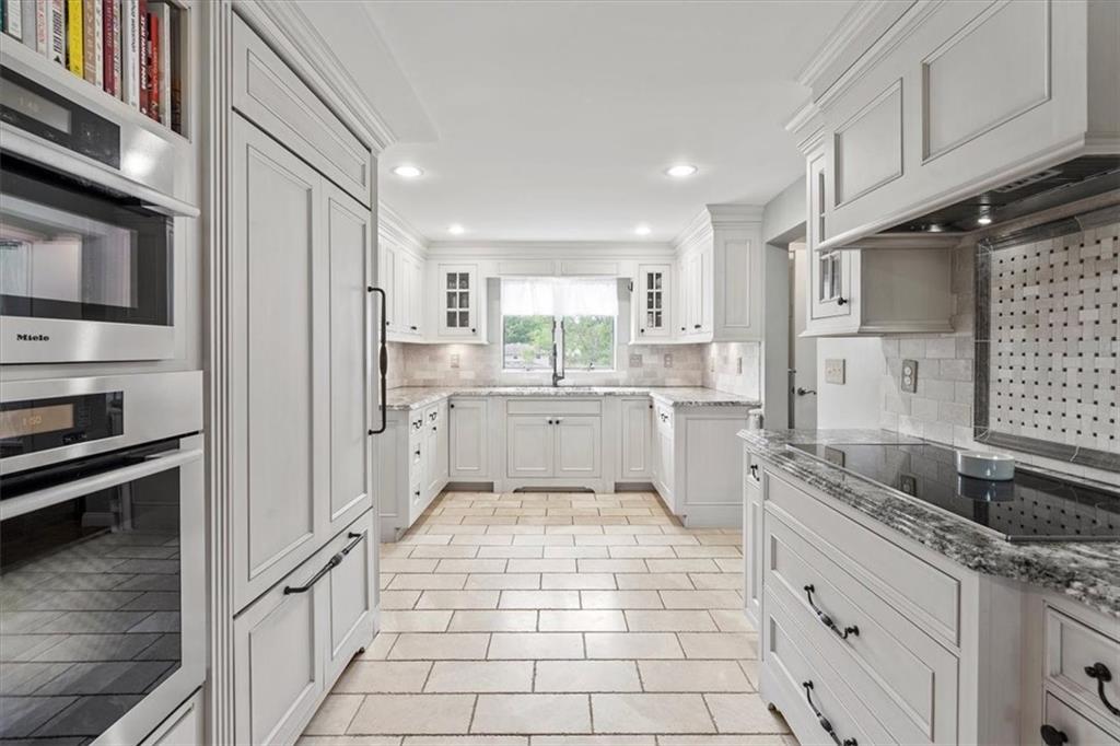 367 Sunset Road Pittsburgh, PA 15237 - Photo 14 of 37 a kitchen with white cabinets and appliances