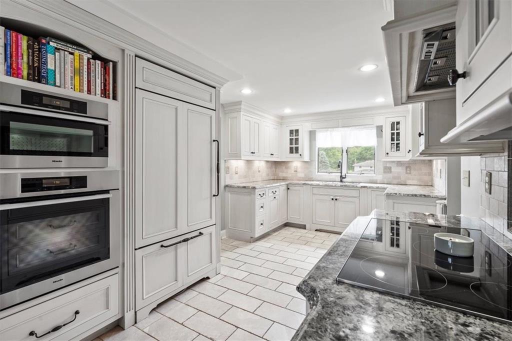 367 Sunset Road Pittsburgh, PA 15237 - Photo 15 of 37 a kitchen with stainless steel appliances granite countertop a stove a sink and a refrigerator