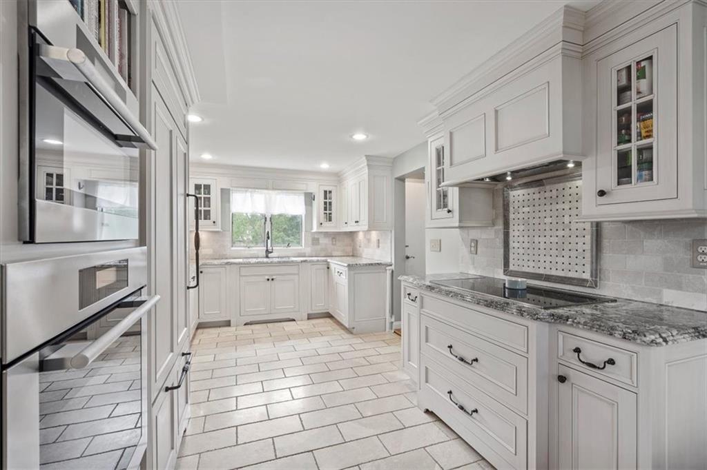 367 Sunset Road Pittsburgh, PA 15237 - Photo 16 of 37 a kitchen with white cabinets and appliances
