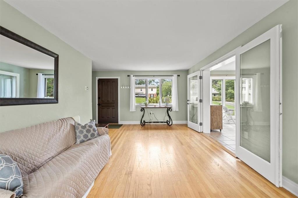 367 Sunset Road Pittsburgh, PA 15237 - Photo 2 of 37 a living room with a bed furniture and next to a window