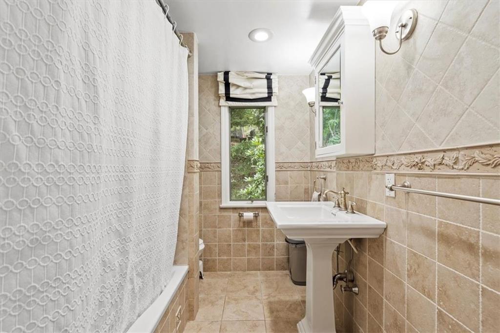367 Sunset Road Pittsburgh, PA 15237 - Photo 23 of 37 a bathroom with a sink a mirror and a shower