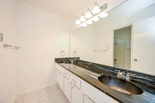a kitchen with a sink and a stove top oven