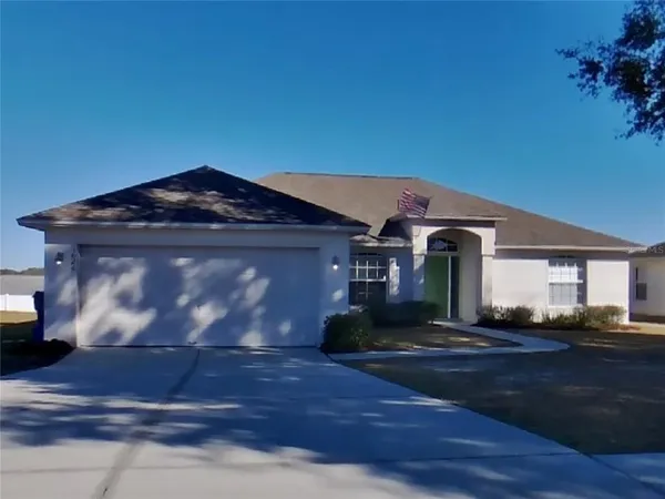 a front view of a house with yard