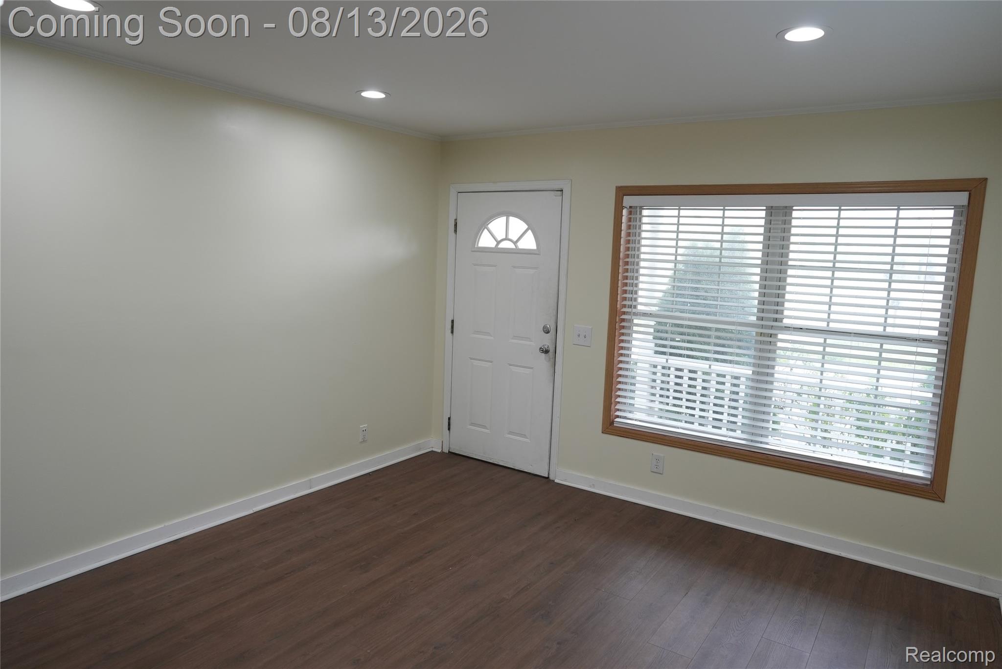 2018 John R Road Troy, MI 48083 - Photo 5 of 57 Recessed ceiling lighting, wood-finish flooring, white baseboards, and a window with wood trim