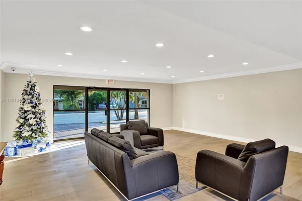 a living room with furniture and a large window