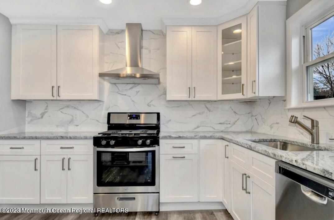 1 Nantucket Court Howell, NJ 07731 - Photo 11 of 38 a kitchen with granite countertop white cabinets and appliances
