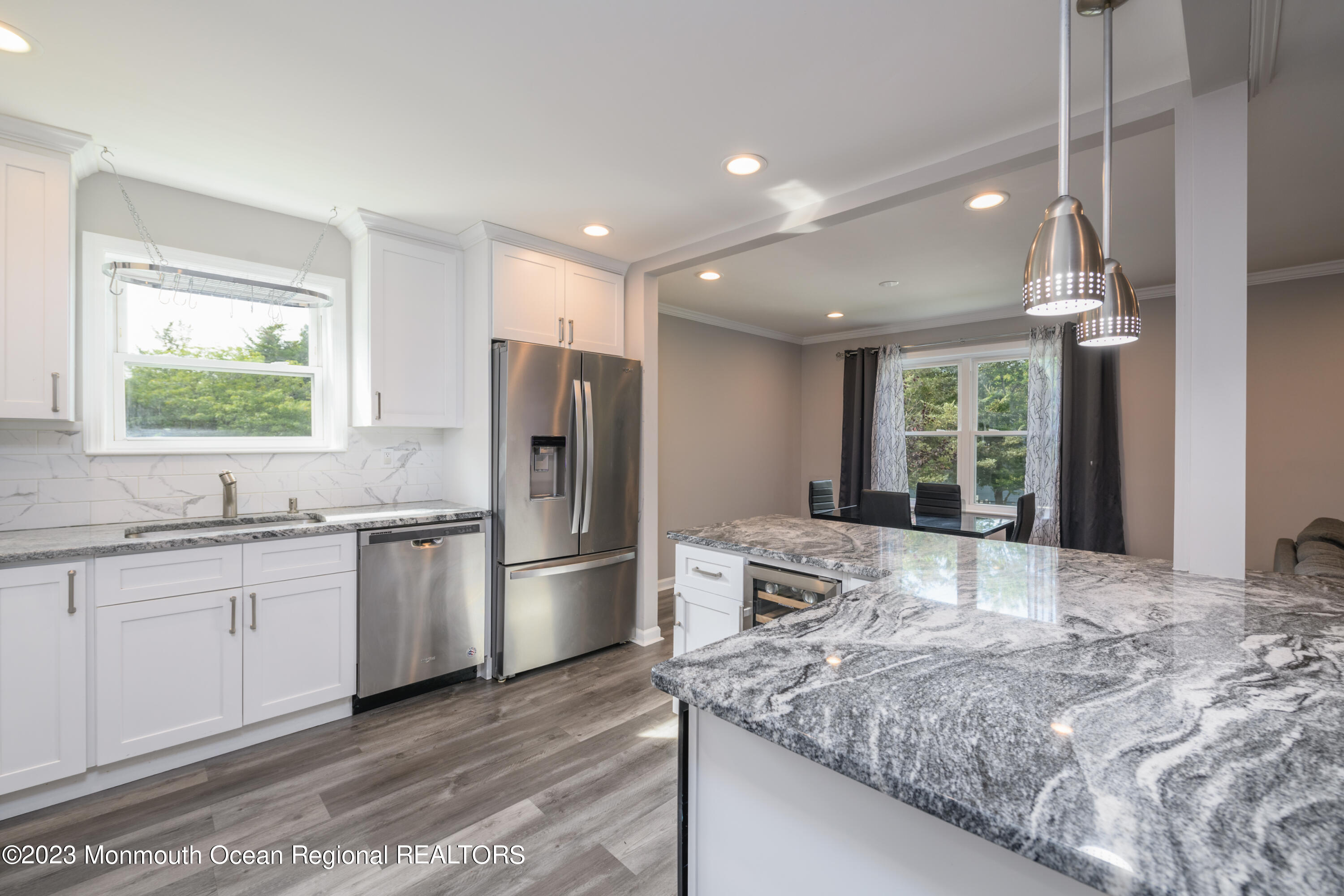 1 Nantucket Court Howell, NJ 07731 - Photo 12 of 38 a kitchen with stainless steel appliances granite countertop sink refrigerator and window