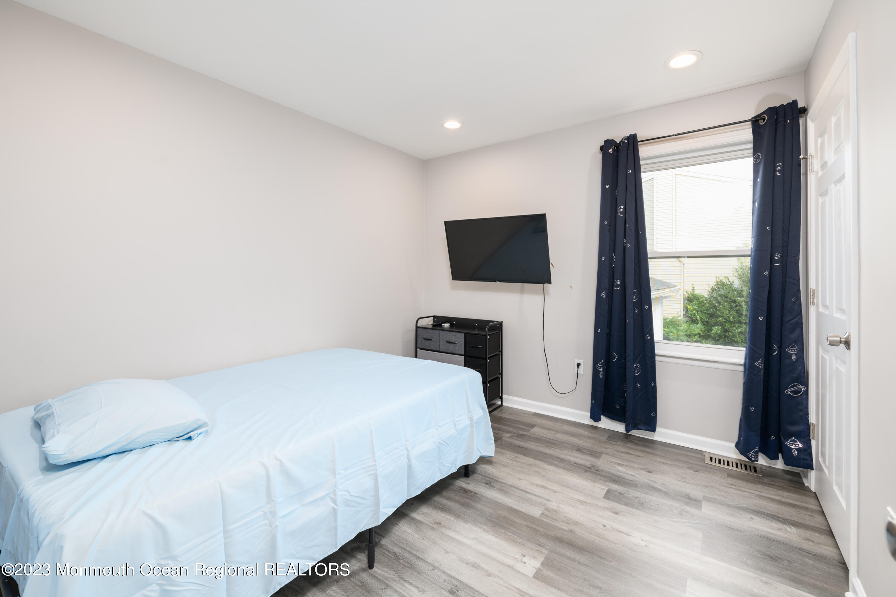 1 Nantucket Court Howell, NJ 07731 - Photo 24 of 38 a bedroom with a bed and a flat screen tv