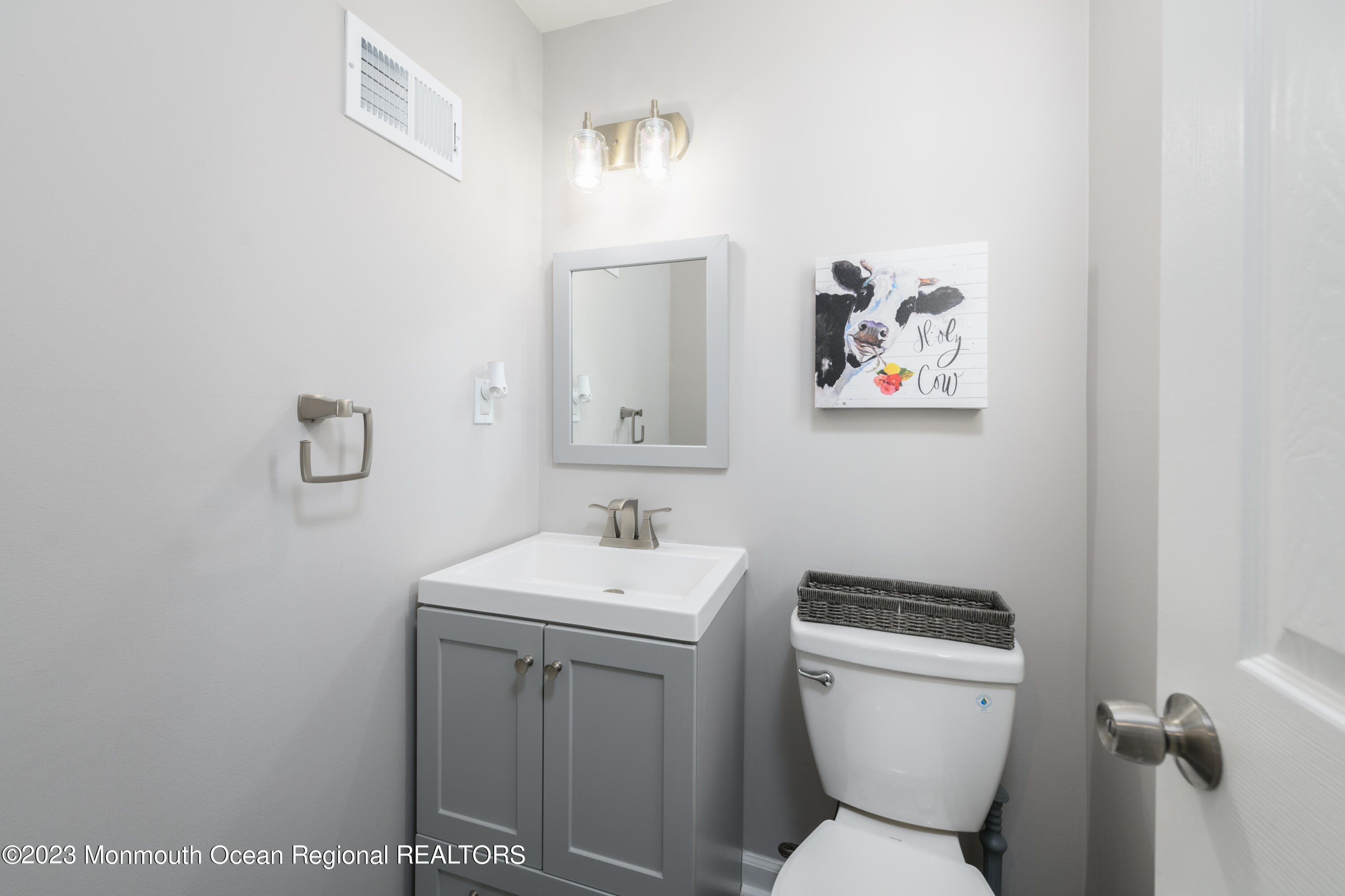 1 Nantucket Court Howell, NJ 07731 - Photo 25 of 38 a bathroom with a toilet a sink and mirror
