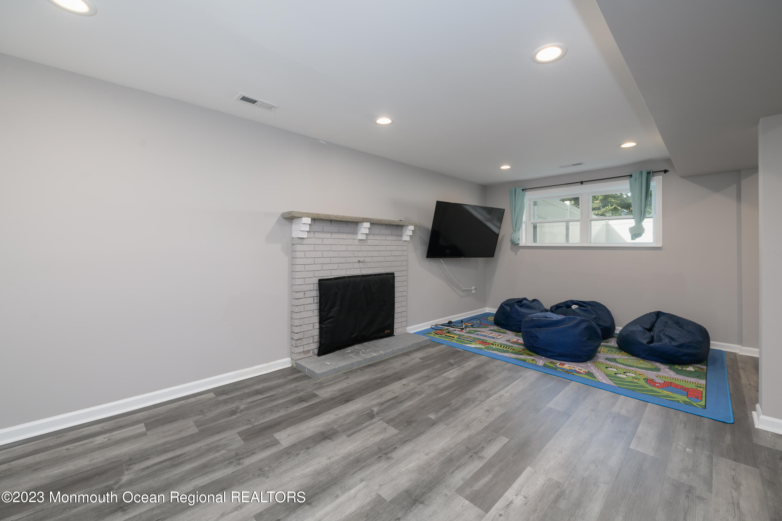 1 Nantucket Court Howell, NJ 07731 - Photo 27 of 38 a room with furniture and a flat screen tv