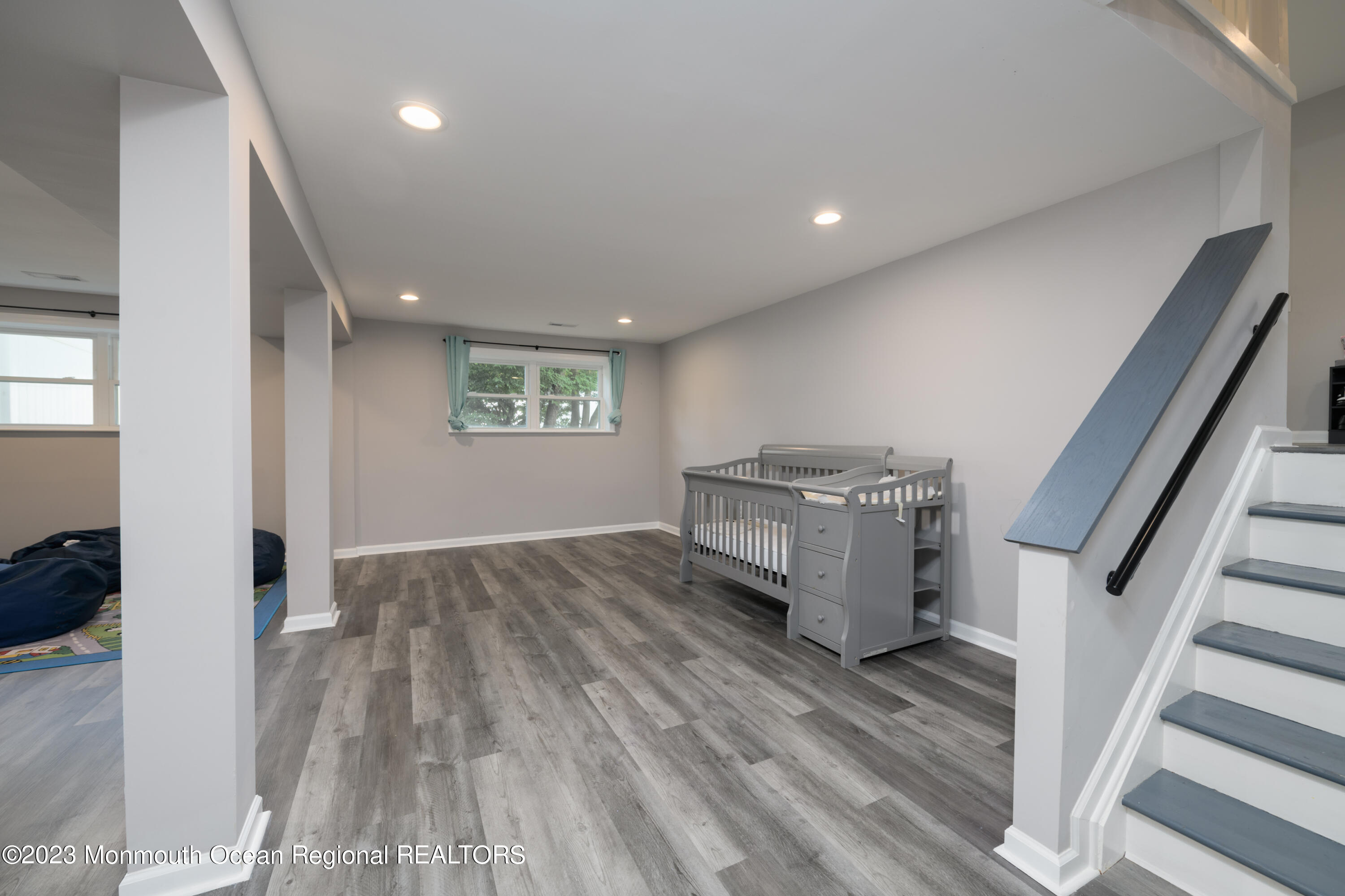 1 Nantucket Court Howell, NJ 07731 - Photo 28 of 38 a view of a hallway with wooden floor and staircase