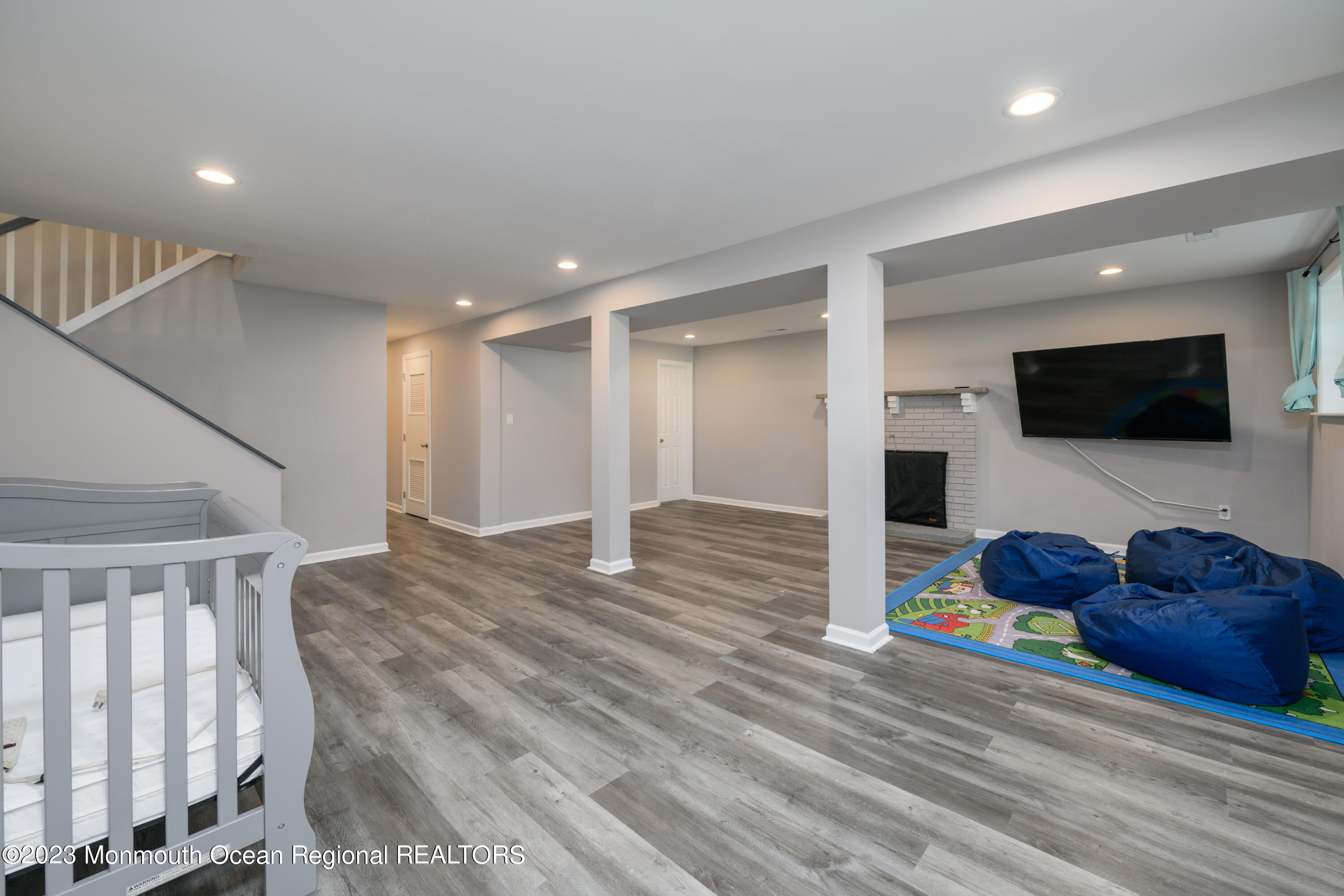 1 Nantucket Court Howell, NJ 07731 - Photo 29 of 38 a living room with couches and a flat screen tv