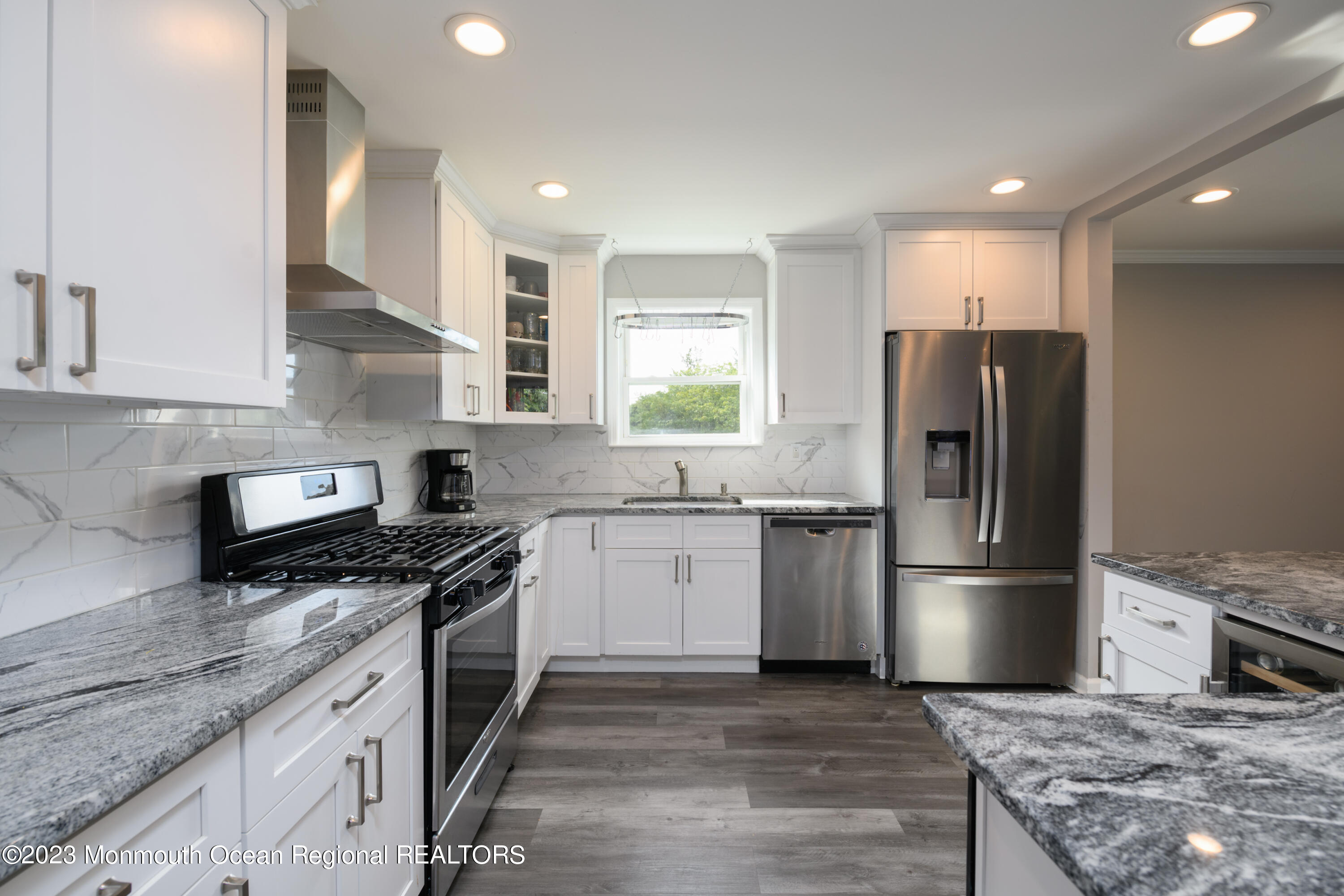 1 Nantucket Court Howell, NJ 07731 - Photo 9 of 38 a kitchen with a sink wooden floor and stainless steel appliances