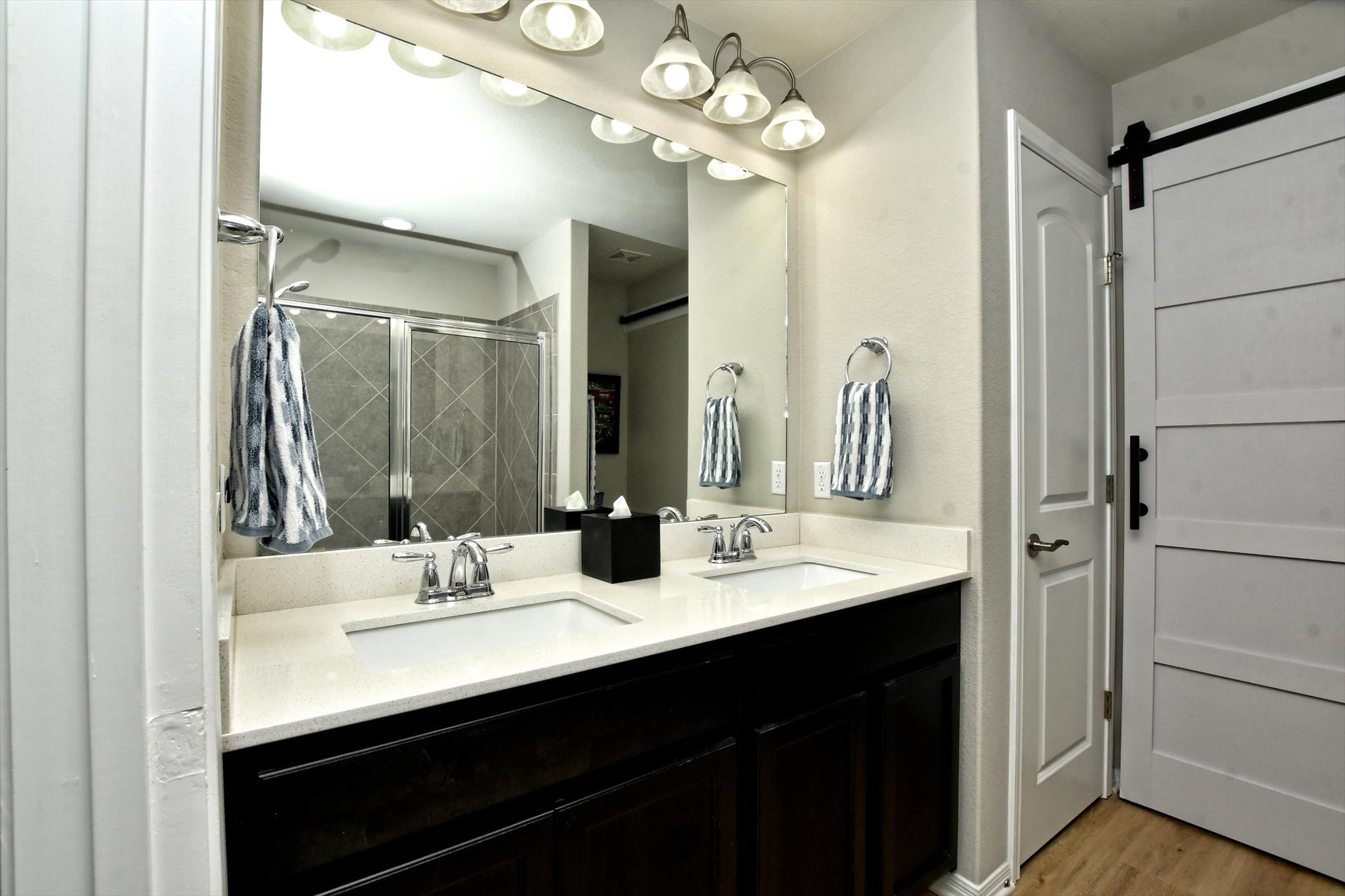 231 Hobby Street Georgetown, TX 78633 - Photo 20 of 29 Double vanities and modern finishes elevate this well-appointed bathroom.
