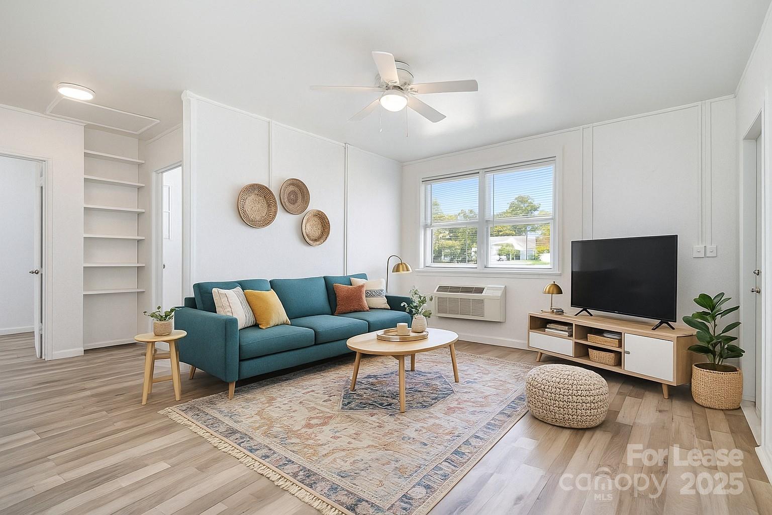 200 York Street, Unit G2 Chester, SC 29706 - Photo 1 of 16 a living room with furniture and a flat screen tv
