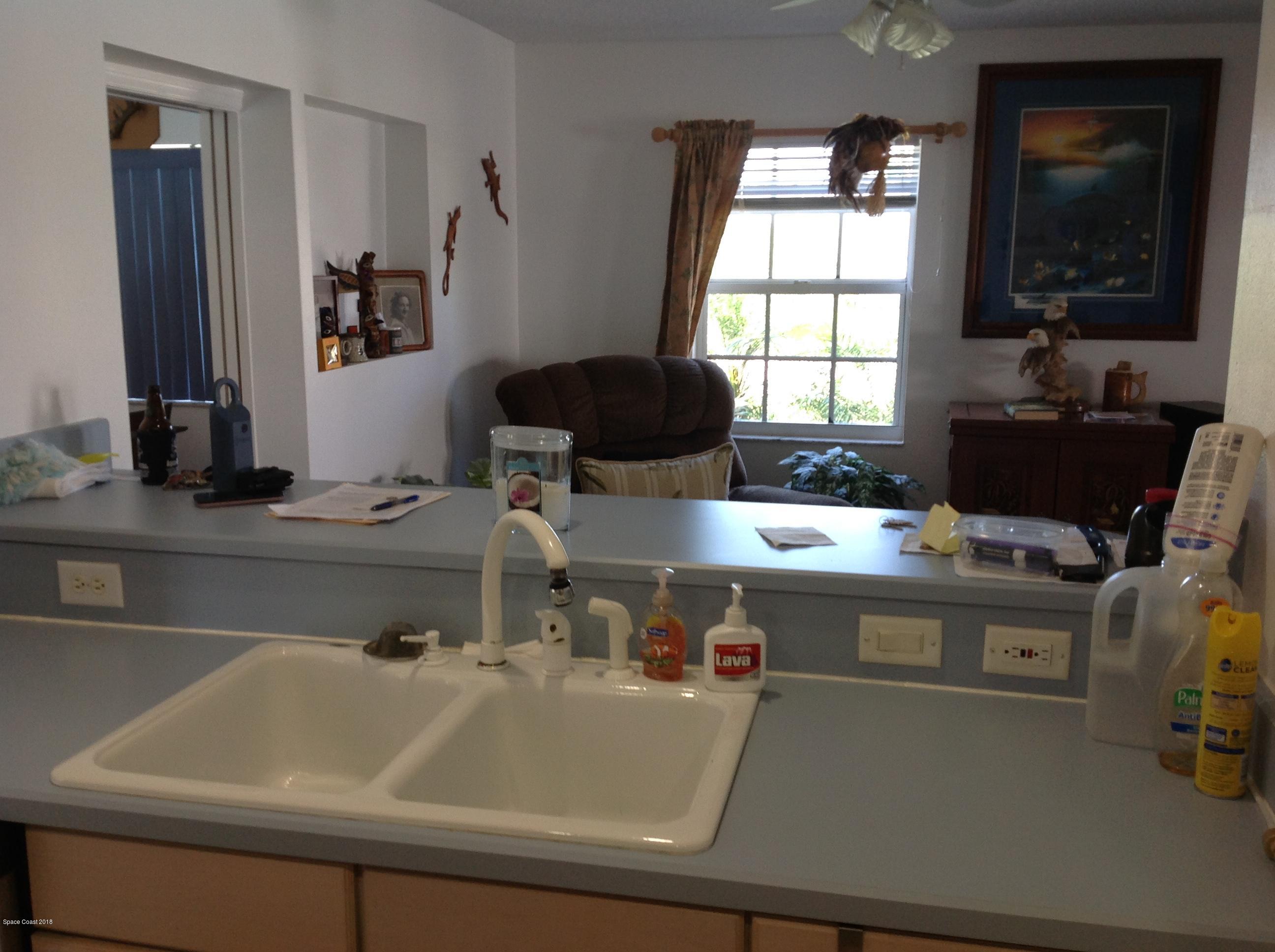 2819 Lancaster Road Melbourne, FL 32935 - Photo 14 of 24 a room with a sink and a window