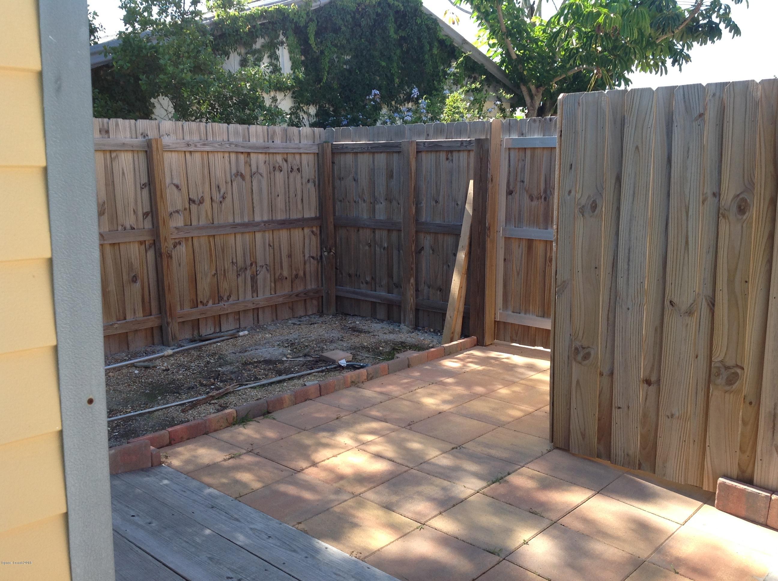 2819 Lancaster Road Melbourne, FL 32935 - Photo 22 of 24 a view of a wooden fence