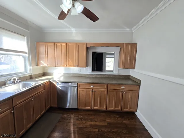 a kitchen with a sink and a window