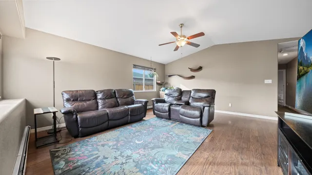 a living room with furniture and a chandelier
