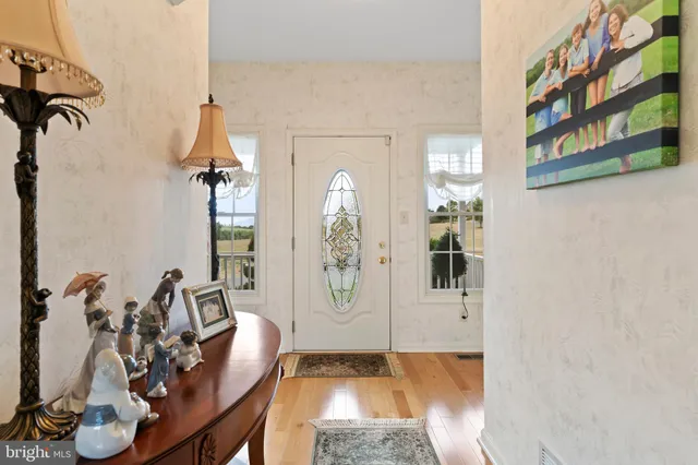a bathroom with a sink mirror and toilet