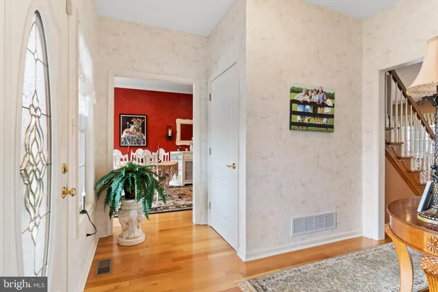 a view of a livingroom with furniture and stairs