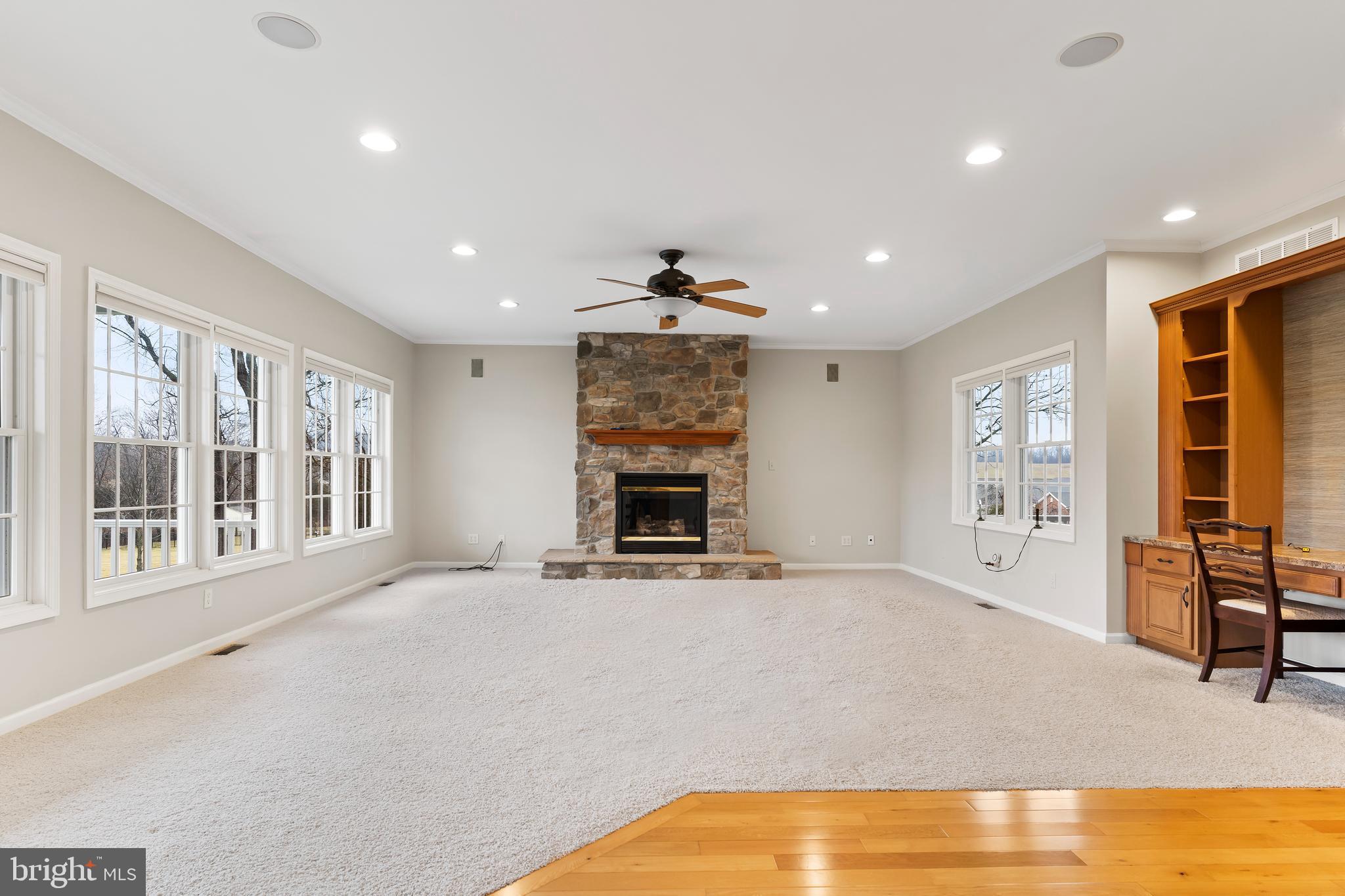 2562 Echo Springs Road, Unit 35 Chambersburg, PA 17202 - Photo 15 of 50 a view of an empty room with a fireplace and a large window