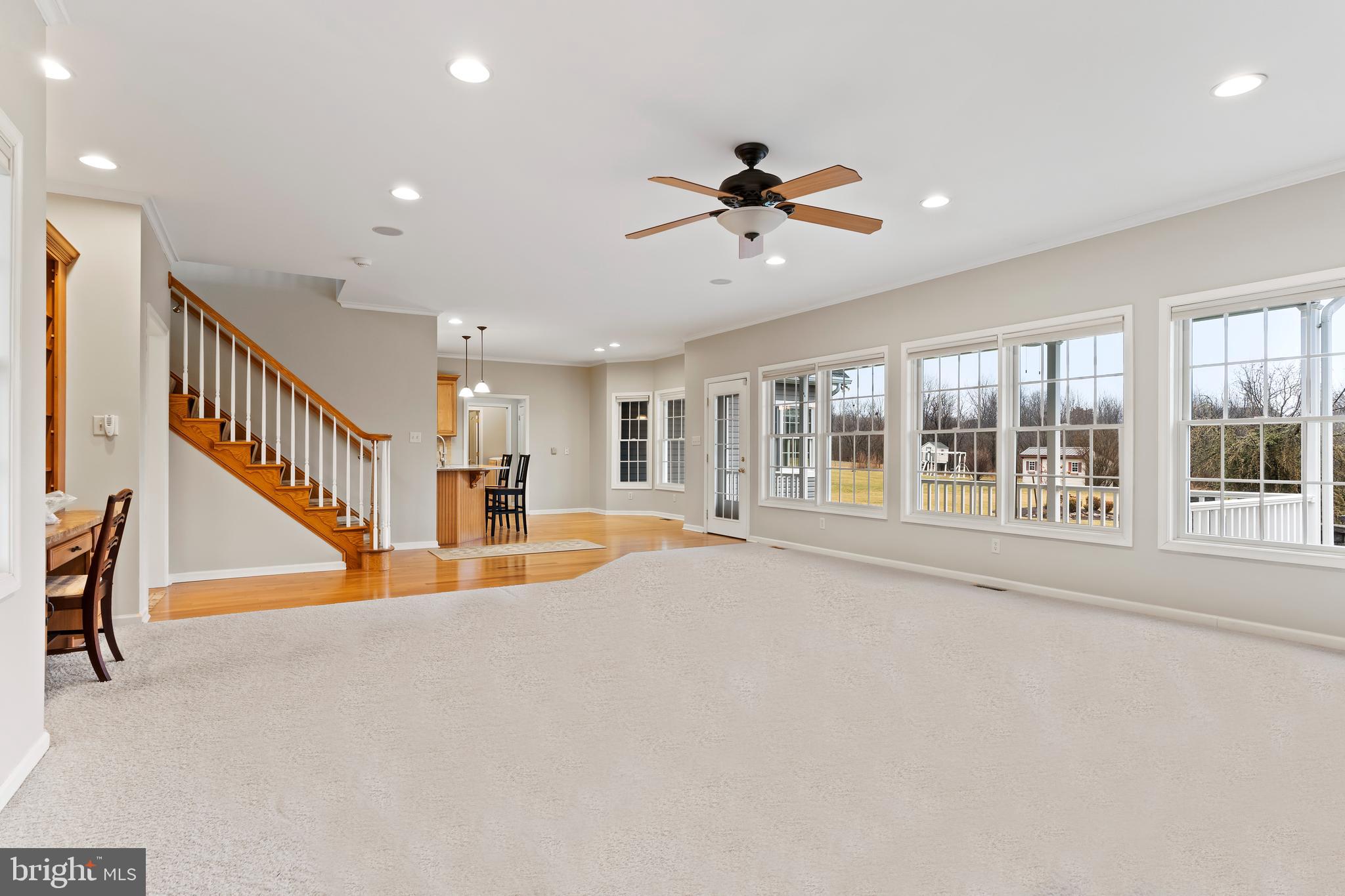 2562 Echo Springs Road, Unit 35 Chambersburg, PA 17202 - Photo 18 of 50 a view of an empty room with wooden floor and a ceiling fan