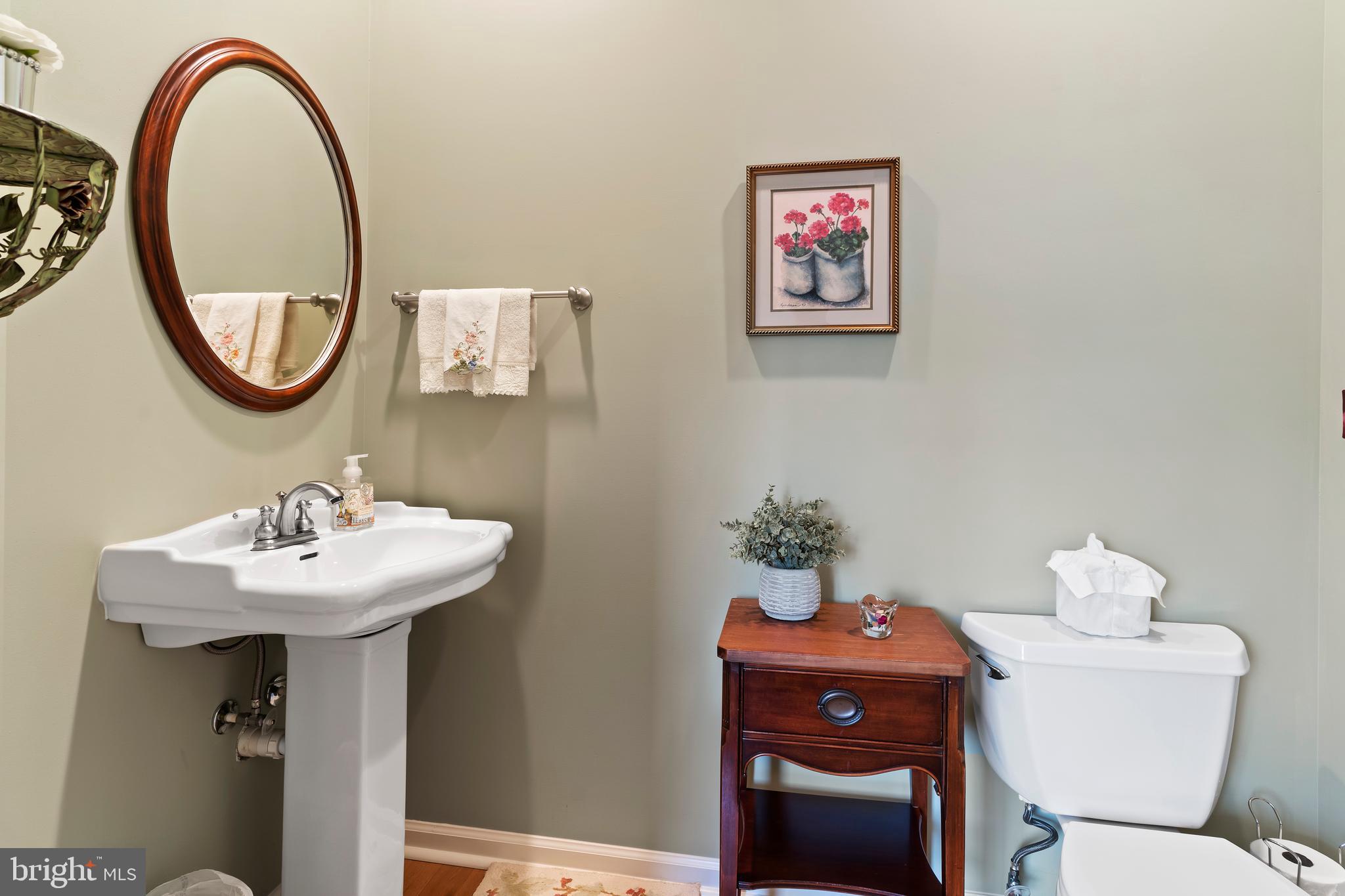 2562 Echo Springs Road, Unit 35 Chambersburg, PA 17202 - Photo 19 of 50 a bathroom with a sink mirror and toilet