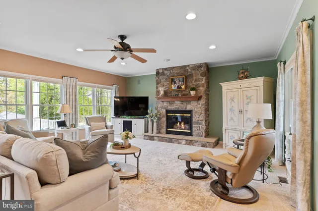 a kitchen with stainless steel appliances granite countertop a sink refrigerator and cabinets