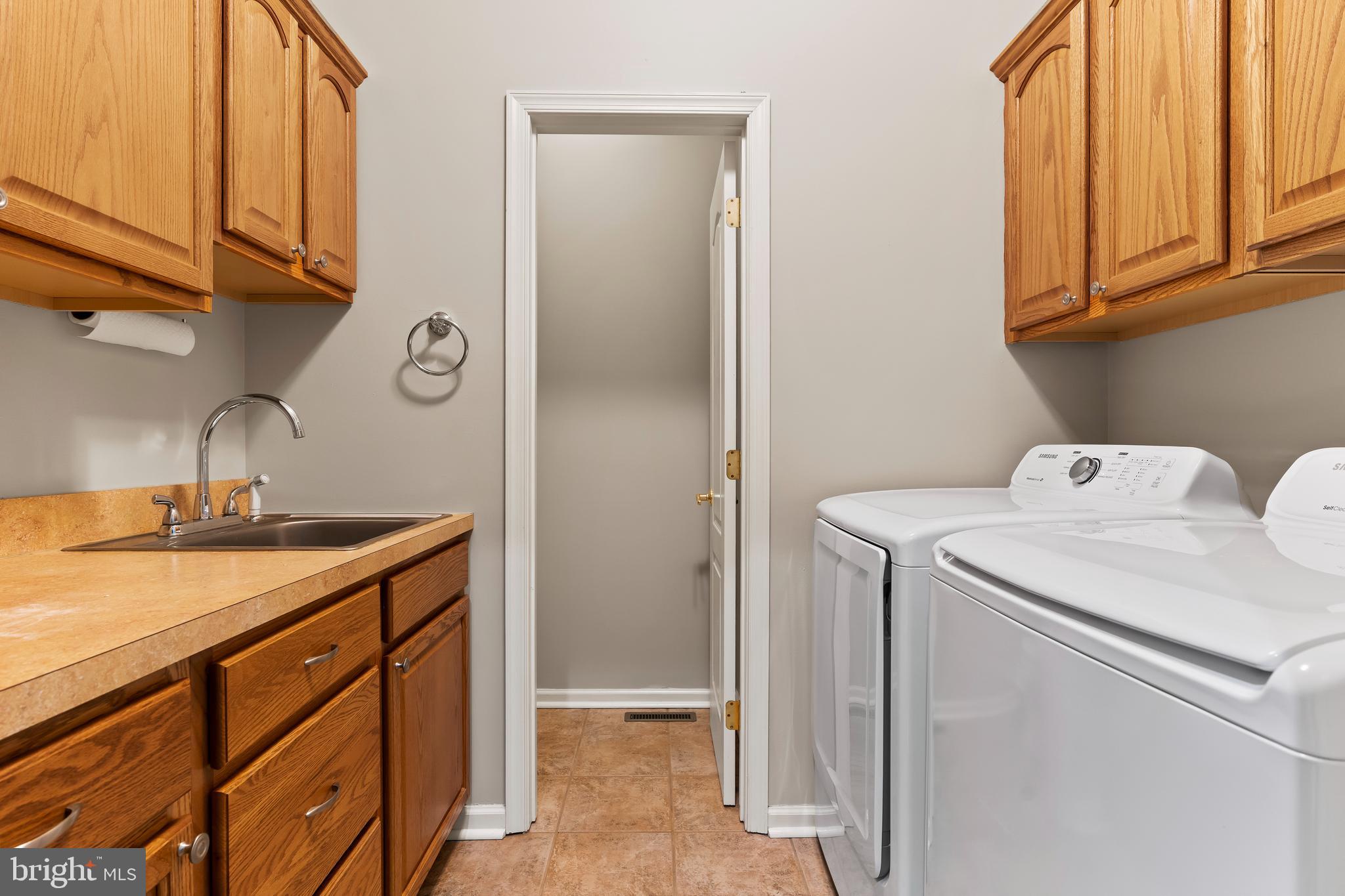 2562 Echo Springs Road, Unit 35 Chambersburg, PA 17202 - Photo 25 of 50 a utility room with a sink a washer and dryer