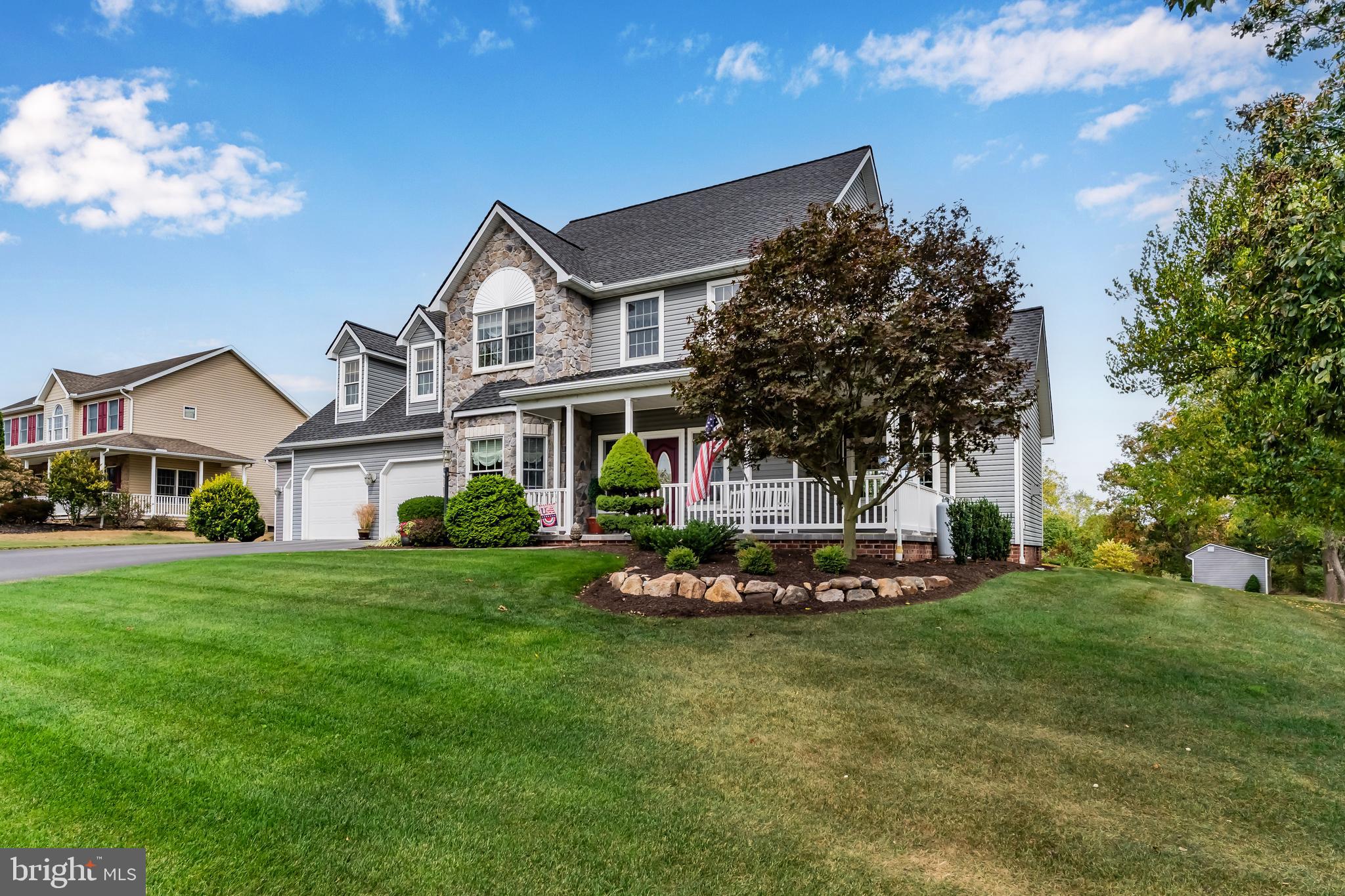 2562 Echo Springs Road, Unit 35 Chambersburg, PA 17202 - Photo 3 of 50 a front view of a house with a garden