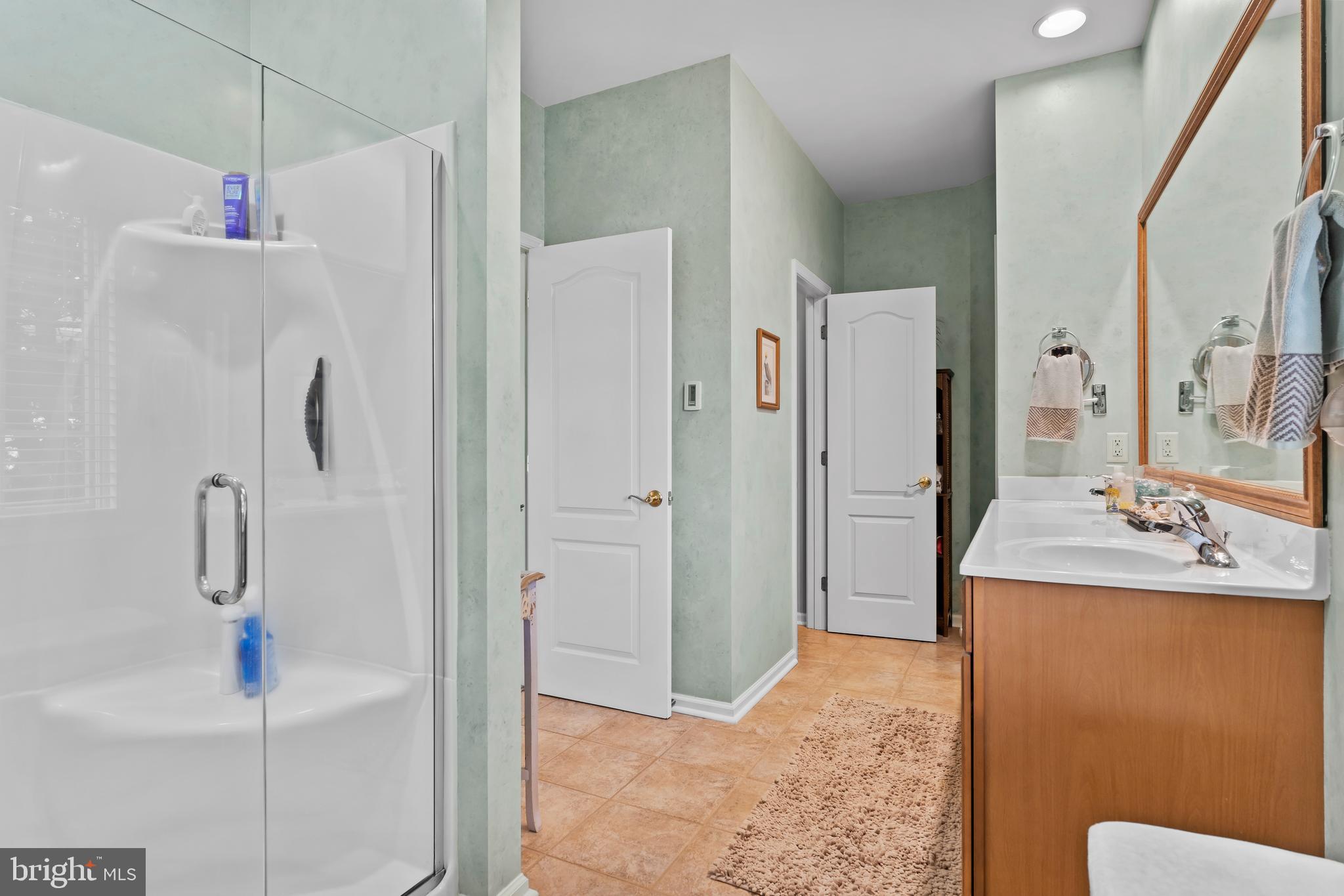 2562 Echo Springs Road, Unit 35 Chambersburg, PA 17202 - Photo 31 of 50 a bathroom with a sink a toilet and shower