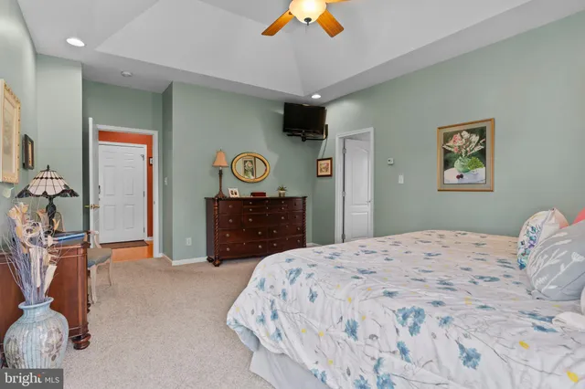 a view of walk in closet with clothes