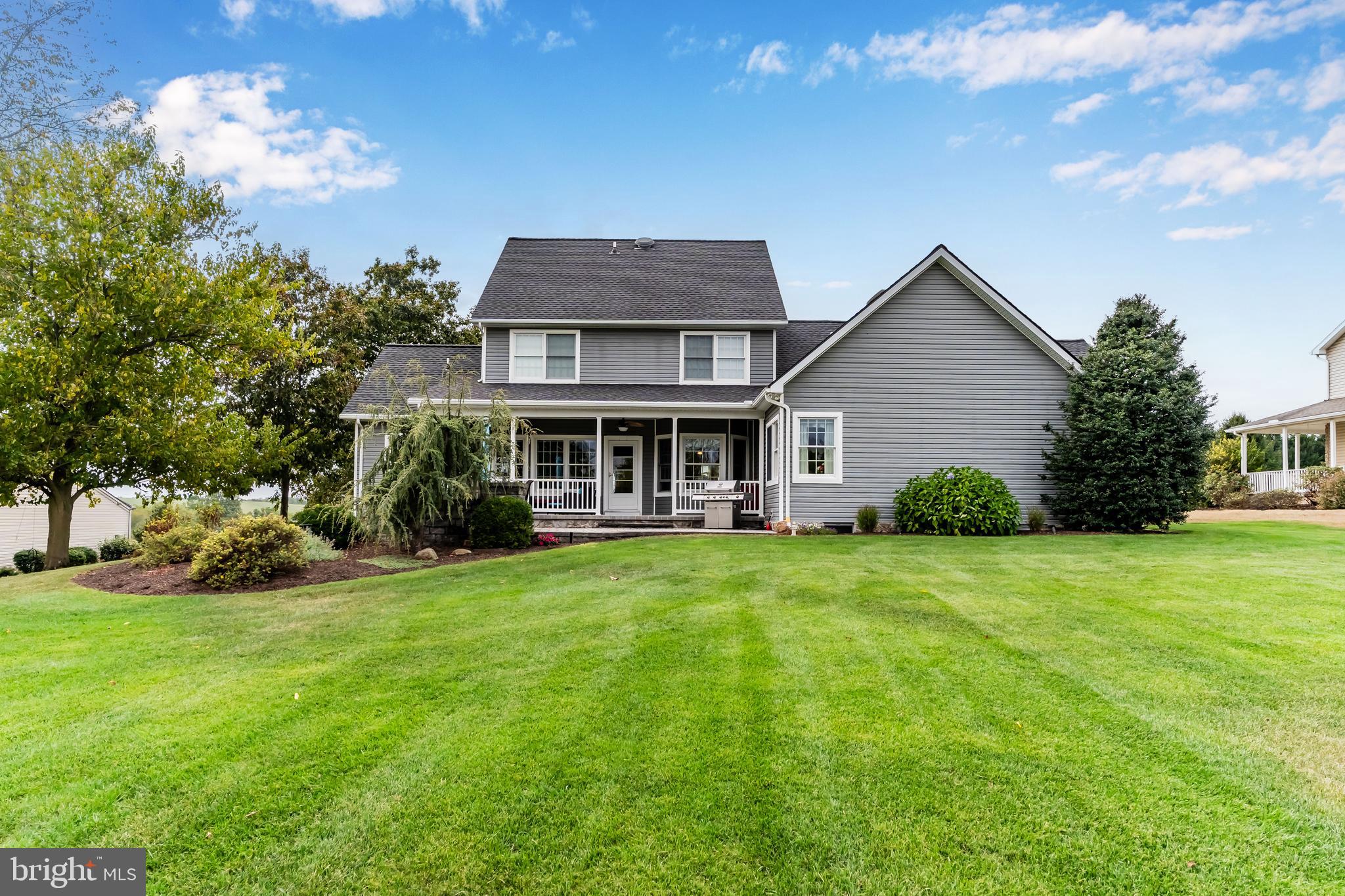 2562 Echo Springs Road, Unit 35 Chambersburg, PA 17202 - Photo 4 of 50 a front view of a house with a yard