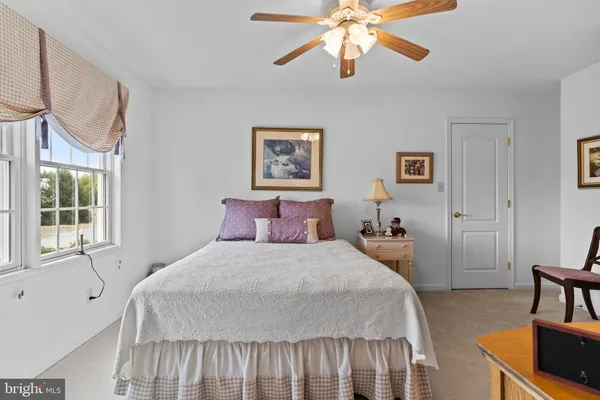 a bedroom with furniture and a chandelier