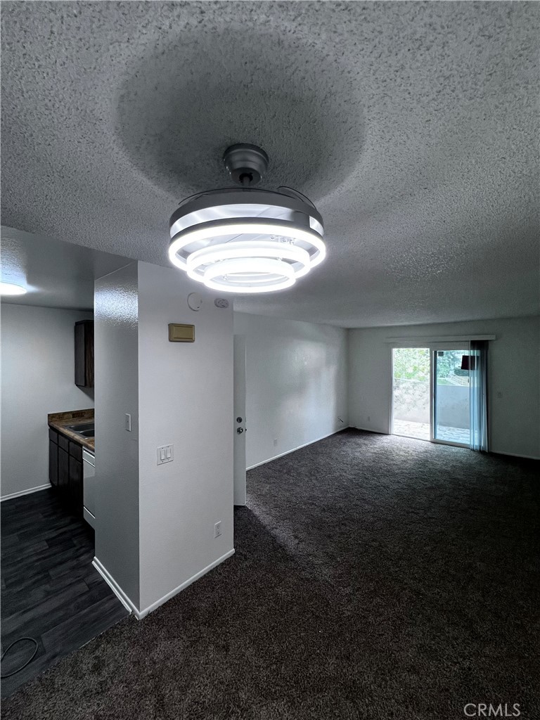 8990 19th Street, Unit 222 Rancho Cucamonga, CA 91701 - Photo 3 of 8 a view of a livingroom with a chandelier