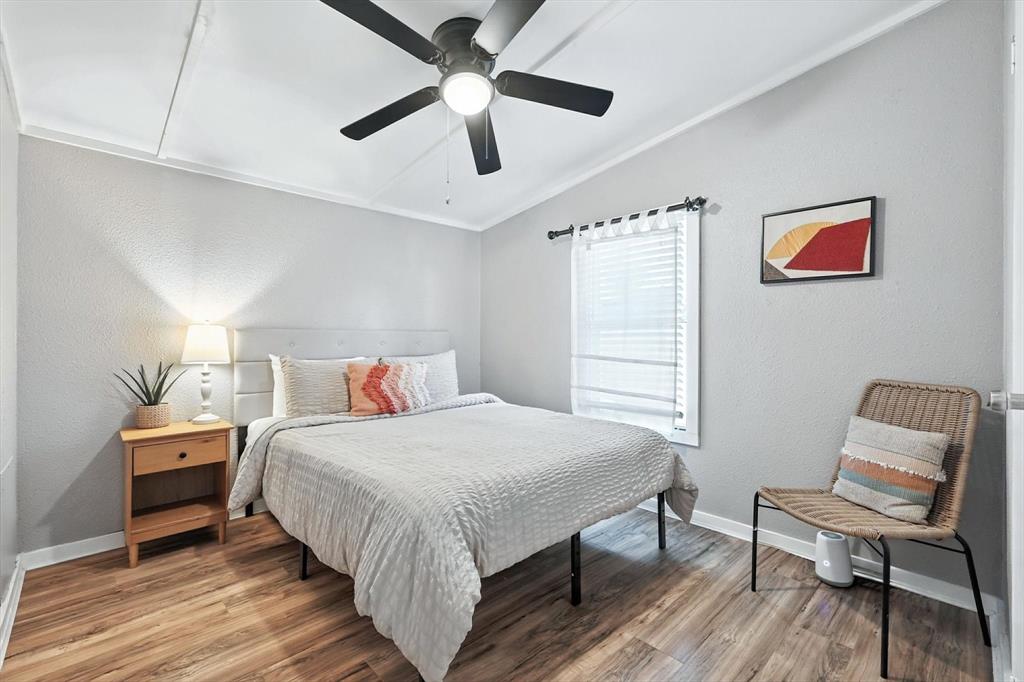 150 Red Bluff Loop Mabank, TX 75156 - Photo 23 of 26 a bedroom with a bed and a chair