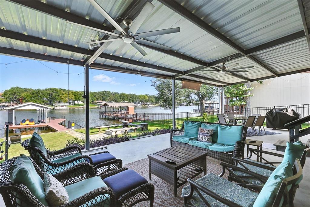 150 Red Bluff Loop Mabank, TX 75156 - Photo 4 of 26 a roof deck with a table and chairs